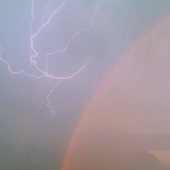 A rainbow next to lightning bolt in Madison, WI
