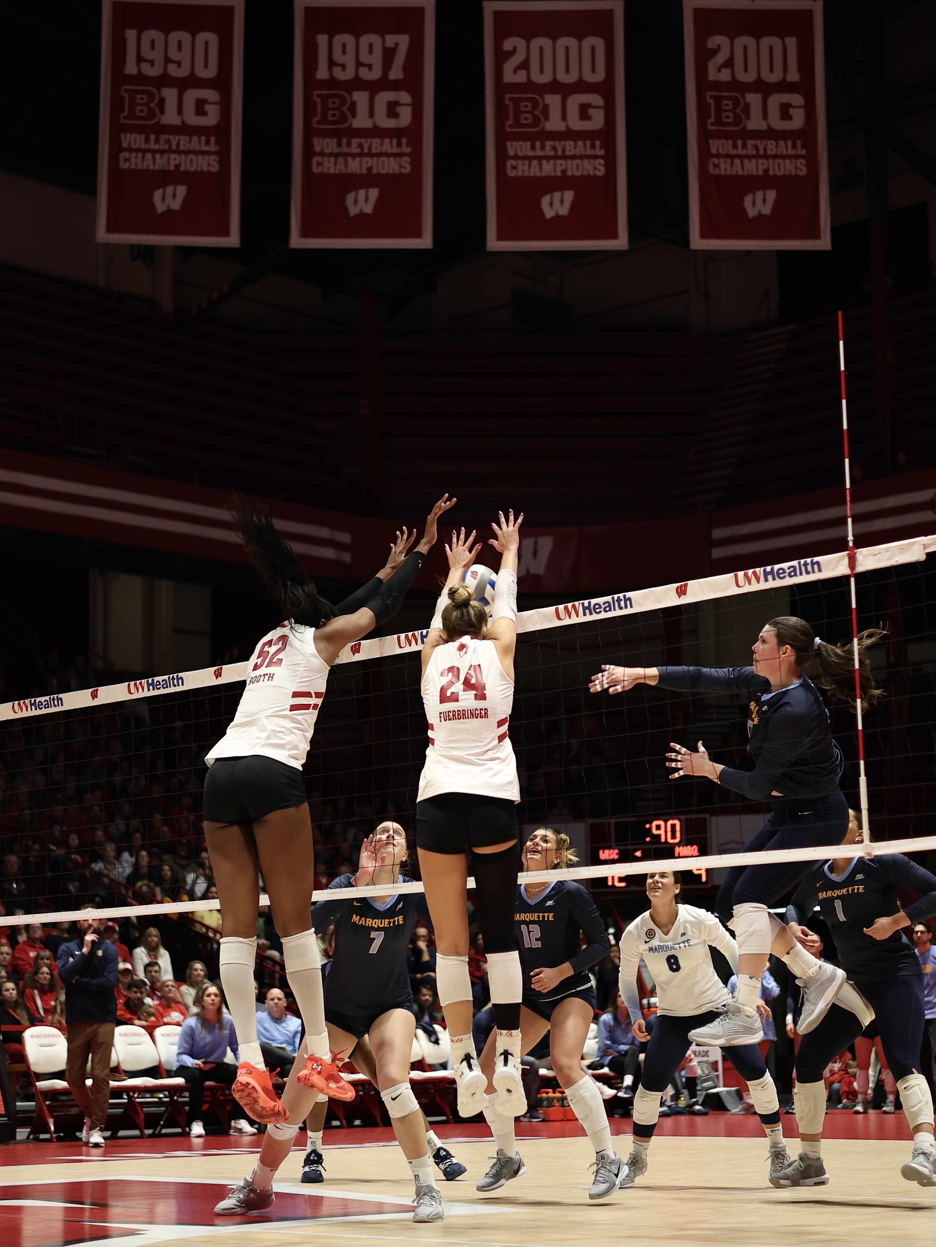 Carter Booth and Charlie Fuerbringer block a Marquette attack (4.16.25).